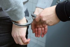 handcuffed for fraud