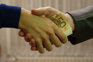 bribe handshake
